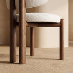 Bay Furniture Round-Back Bouclé Dining Chair with Walnut Cylinder Legs